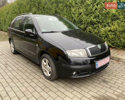 Черный Шкода Фабия, объемом двигателя 1.4 л и пробегом 246 тыс. км за 4399 $, фото 1 на Automoto.ua
