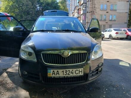 Черный Шкода Фабия, объемом двигателя 1.4 л и пробегом 124 тыс. км за 5650 $, фото 1 на Automoto.ua