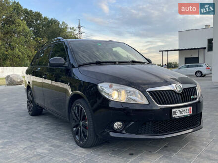 Черный Шкода Фабия, объемом двигателя 1.4 л и пробегом 179 тыс. км за 7750 $, фото 1 на Automoto.ua