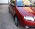 Красный Шкода Фабия, объемом двигателя 1.2 л и пробегом 230 тыс. км за 3950 $, фото 2 на Automoto.ua