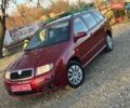 Красный Шкода Фабия, объемом двигателя 1.39 л и пробегом 201 тыс. км за 4199 $, фото 2 на Automoto.ua