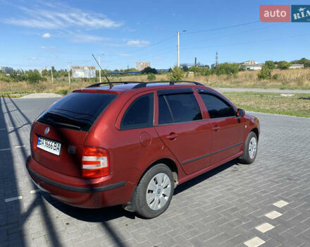 Красный Шкода Фабия, объемом двигателя 1.39 л и пробегом 264 тыс. км за 5300 $, фото 2 на Automoto.ua