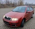 Красный Шкода Фабия, объемом двигателя 1.4 л и пробегом 225 тыс. км за 4400 $, фото 1 на Automoto.ua