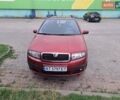 Красный Шкода Фабия, объемом двигателя 1.39 л и пробегом 240 тыс. км за 4800 $, фото 1 на Automoto.ua