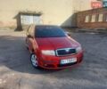 Красный Шкода Фабия, объемом двигателя 1.4 л и пробегом 302 тыс. км за 4900 $, фото 1 на Automoto.ua