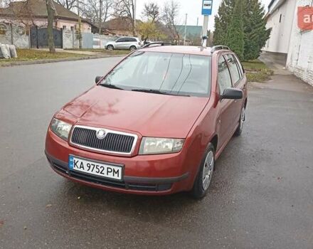 Красный Шкода Фабия, объемом двигателя 1.2 л и пробегом 214 тыс. км за 3800 $, фото 1 на Automoto.ua