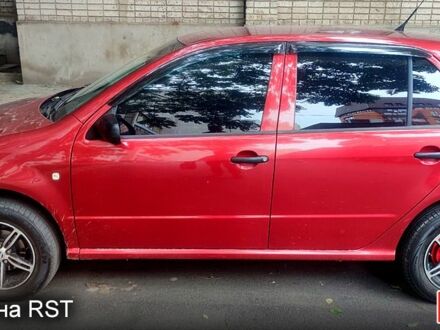 Красный Шкода Фабия, объемом двигателя 1.2 л и пробегом 255 тыс. км за 3400 $, фото 1 на Automoto.ua