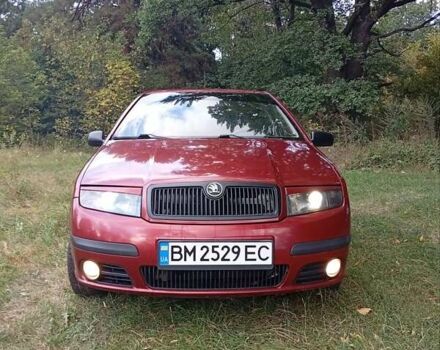 Красный Шкода Фабия, объемом двигателя 1.2 л и пробегом 265 тыс. км за 3200 $, фото 1 на Automoto.ua