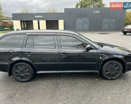 Черный Шкода Октавия, объемом двигателя 1.6 л и пробегом 375 тыс. км за 4600 $, фото 6 на Automoto.ua