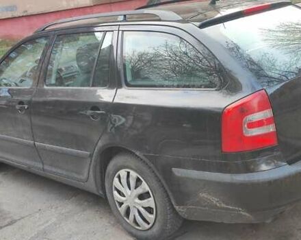 Черный Шкода Октавия, объемом двигателя 1.6 л и пробегом 235 тыс. км за 5400 $, фото 2 на Automoto.ua