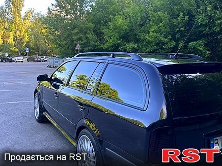 Черный Шкода Октавия, объемом двигателя 1.8 л и пробегом 322 тыс. км за 7500 $, фото 2 на Automoto.ua