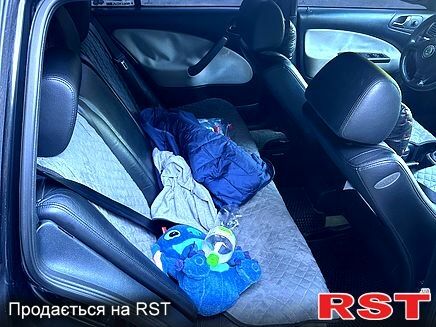 Черный Шкода Октавия, объемом двигателя 1.8 л и пробегом 322 тыс. км за 7500 $, фото 4 на Automoto.ua