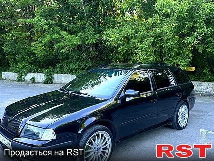 Черный Шкода Октавия, объемом двигателя 1.8 л и пробегом 322 тыс. км за 7500 $, фото 1 на Automoto.ua