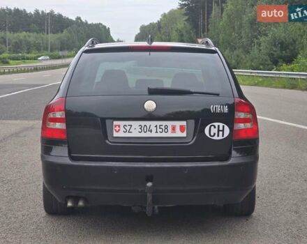 Черный Шкода Октавия, объемом двигателя 2 л и пробегом 245 тыс. км за 9199 $, фото 3 на Automoto.ua