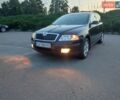 Черный Шкода Октавия, объемом двигателя 1.8 л и пробегом 155 тыс. км за 7599 $, фото 1 на Automoto.ua