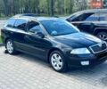 Черный Шкода Октавия, объемом двигателя 1.6 л и пробегом 223 тыс. км за 6300 $, фото 1 на Automoto.ua
