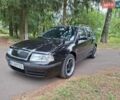 Черный Шкода Октавия, объемом двигателя 1.6 л и пробегом 217 тыс. км за 5200 $, фото 1 на Automoto.ua
