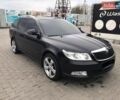 Черный Шкода Октавия, объемом двигателя 2 л и пробегом 235 тыс. км за 9900 $, фото 1 на Automoto.ua