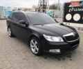 Черный Шкода Октавия, объемом двигателя 2 л и пробегом 235 тыс. км за 9700 $, фото 1 на Automoto.ua