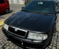 Черный Шкода Октавия, объемом двигателя 1.6 л и пробегом 215 тыс. км за 4900 $, фото 1 на Automoto.ua
