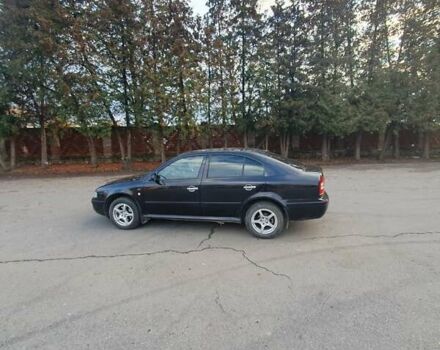 Черный Шкода Октавия, объемом двигателя 1.8 л и пробегом 281 тыс. км за 5500 $, фото 10 на Automoto.ua