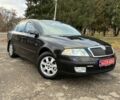 Черный Шкода Октавия, объемом двигателя 1.6 л и пробегом 180 тыс. км за 5750 $, фото 1 на Automoto.ua