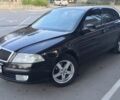 Черный Шкода Октавия, объемом двигателя 1.6 л и пробегом 235 тыс. км за 6000 $, фото 1 на Automoto.ua