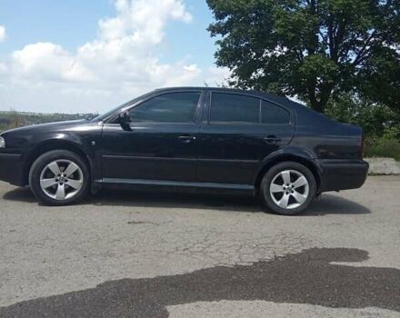 Черный Шкода Октавия, объемом двигателя 1.6 л и пробегом 330 тыс. км за 5600 $, фото 2 на Automoto.ua