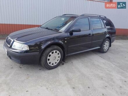 Черный Шкода Октавия, объемом двигателя 2.01 л и пробегом 317 тыс. км за 4200 $, фото 1 на Automoto.ua