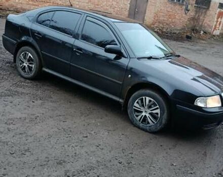 Черный Шкода Октавия, объемом двигателя 1.6 л и пробегом 175 тыс. км за 5750 $, фото 1 на Automoto.ua