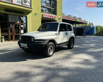 Белый Cанг Йонг Корандо, объемом двигателя 2.3 л и пробегом 268 тыс. км за 7399 $, фото 5 на Automoto.ua