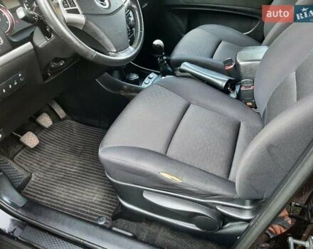 Черный Cанг Йонг Корандо, объемом двигателя 2 л и пробегом 149 тыс. км за 6999 $, фото 14 на Automoto.ua