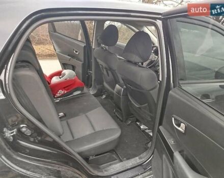 Чорний Cанг Йонг Korando, об'ємом двигуна 2 л та пробігом 130 тис. км за 10000 $, фото 8 на Automoto.ua