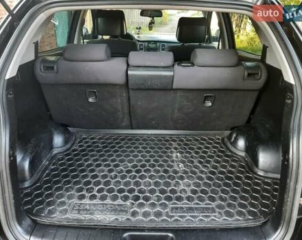 Черный Cанг Йонг Корандо, объемом двигателя 2 л и пробегом 149 тыс. км за 6999 $, фото 8 на Automoto.ua