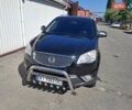 Черный Cанг Йонг Корандо, объемом двигателя 2 л и пробегом 180 тыс. км за 10000 $, фото 3 на Automoto.ua