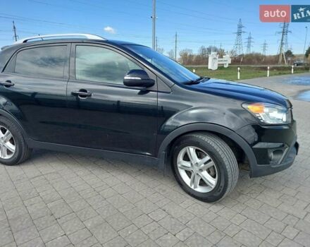 Черный Cанг Йонг Корандо, объемом двигателя 2 л и пробегом 163 тыс. км за 10599 $, фото 3 на Automoto.ua