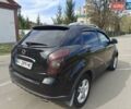 Черный Cанг Йонг Корандо, объемом двигателя 2 л и пробегом 240 тыс. км за 10000 $, фото 4 на Automoto.ua