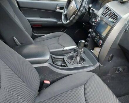 Черный Cанг Йонг Кирон, объемом двигателя 2.3 л и пробегом 129 тыс. км за 6900 $, фото 11 на Automoto.ua