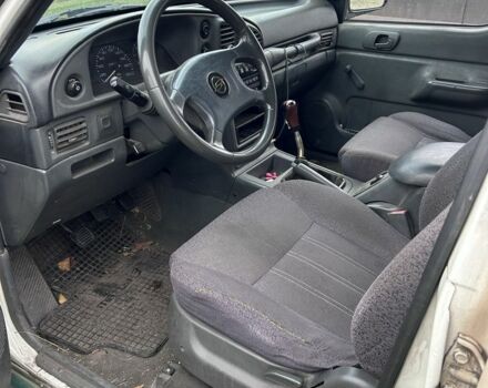 Белый Cанг Йонг Муссо, объемом двигателя 2.9 л и пробегом 200 тыс. км за 1426 $, фото 7 на Automoto.ua