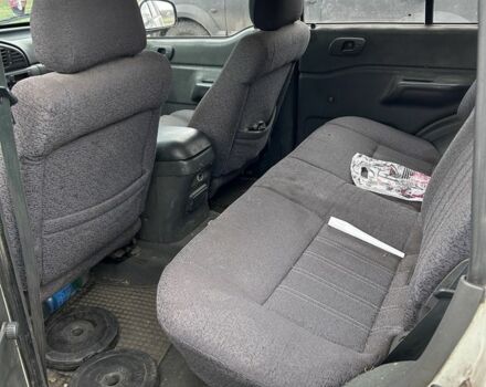 Белый Cанг Йонг Муссо, объемом двигателя 2.9 л и пробегом 200 тыс. км за 1426 $, фото 6 на Automoto.ua