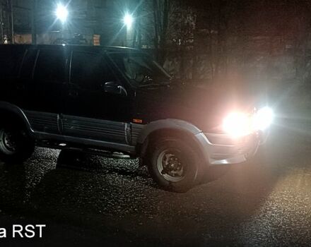 Чорний Cанг Йонг Муссо, об'ємом двигуна 2.9 л та пробігом 320 тис. км за 3300 $, фото 1 на Automoto.ua