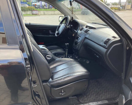 Чорний Cанг Йонг Rexton, об'ємом двигуна 2.7 л та пробігом 159 тис. км за 9500 $, фото 11 на Automoto.ua