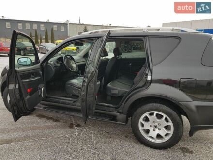 Чорний Cанг Йонг Rexton, об'ємом двигуна 2.7 л та пробігом 245 тис. км за 6800 $, фото 1 на Automoto.ua