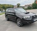 Черный Субару Форестер, объемом двигателя 2.5 л и пробегом 300 тыс. км за 6499 $, фото 4 на Automoto.ua