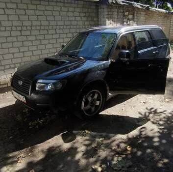 Черный Субару Форестер, объемом двигателя 2.46 л и пробегом 318 тыс. км за 6999 $, фото 4 на Automoto.ua