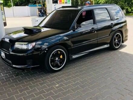 Черный Субару Форестер, объемом двигателя 2.46 л и пробегом 97 тыс. км за 12000 $, фото 1 на Automoto.ua