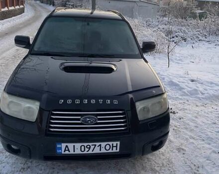 Черный Субару Форестер, объемом двигателя 2.46 л и пробегом 180 тыс. км за 6000 $, фото 1 на Automoto.ua