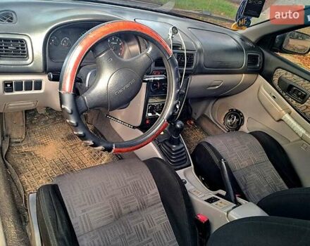 Красный Субару Импреза, объемом двигателя 1.6 л и пробегом 150 тыс. км за 2600 $, фото 4 на Automoto.ua