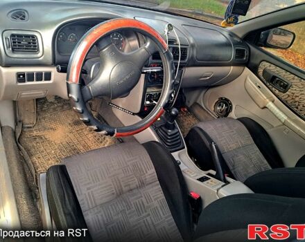 Красный Субару Импреза, объемом двигателя 1.6 л и пробегом 150 тыс. км за 2600 $, фото 5 на Automoto.ua