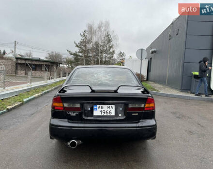 Черный Субару Легаси, объемом двигателя 2.46 л и пробегом 324 тыс. км за 4200 $, фото 4 на Automoto.ua